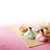 お雛さまと和菓子をあしらった、ひな祭りの可愛らしい絵葉書テンプレート