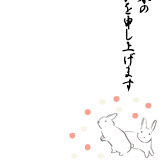 紅白の玉と線画のウサギを描いた年賀状